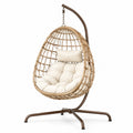 Fauteuil suspendu en rotin naturel et métal marron, support style bohème, dimensions 105x105x195 cm, par Tornavik.